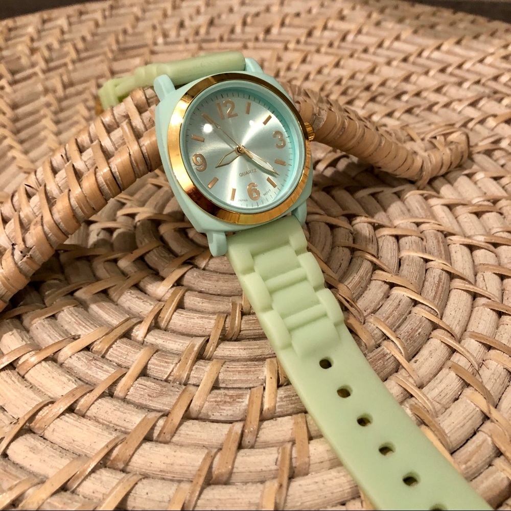 Teal rubber watch with gold accents